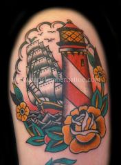 Traditional Light house and galleon tattoo